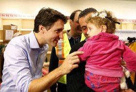 Syrian Refugees Greeted by Justin Trudeau in Canada